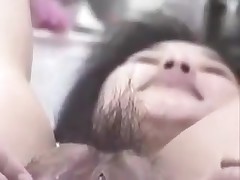 Korean slut with big pussy and pouty lips gets naughty on camera. She stuffs her hairy pussy with fingers, metal balls and even a bottle. This cunt can swallow a lot of jizz too!